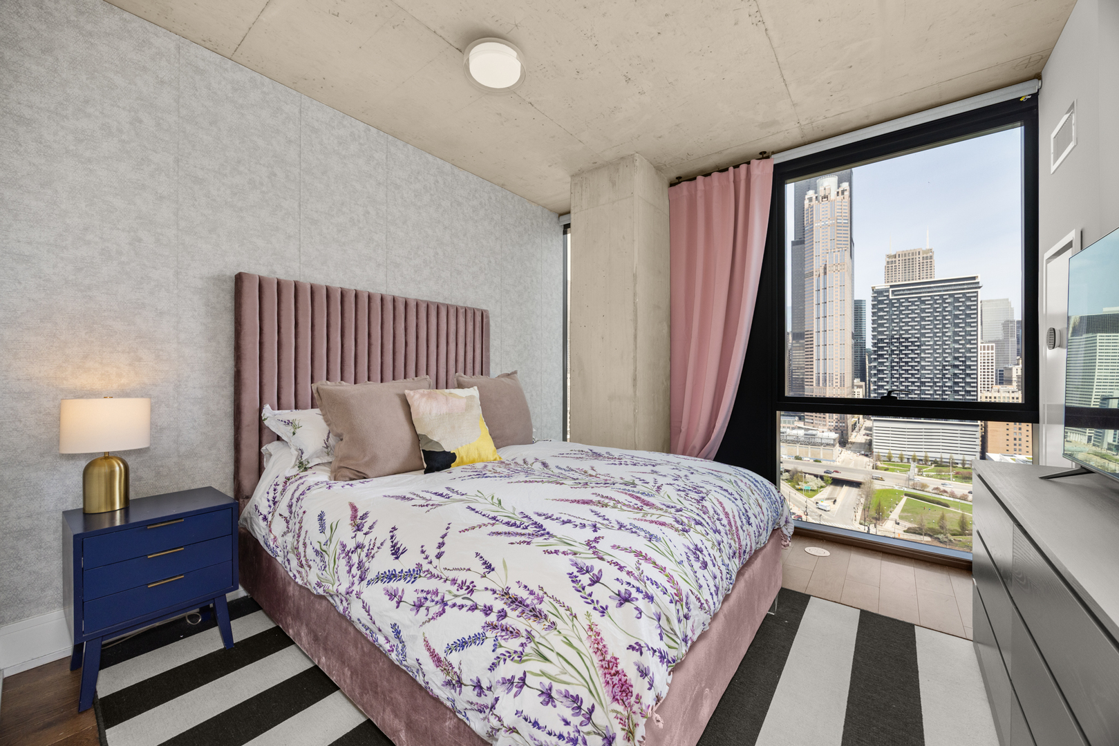 Undisclosed Address Chicago, IL 60607 - Photo 20 of 44 a bedroom with a bed and wooden floor