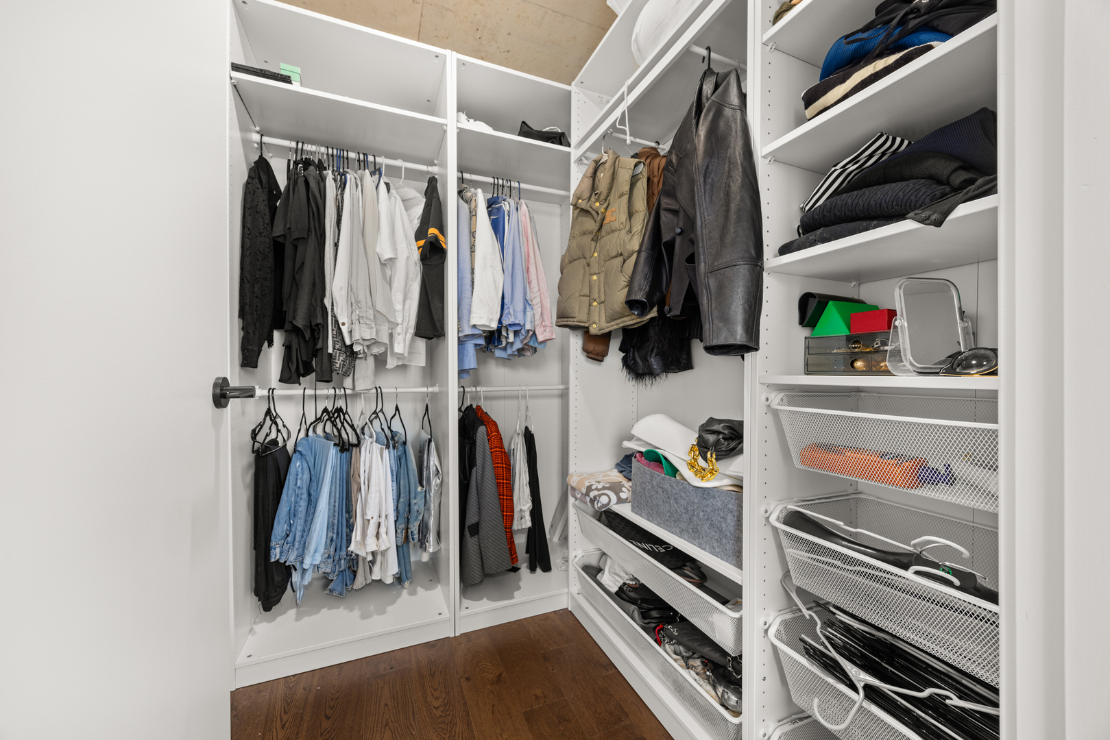 Undisclosed Address Chicago, IL 60607 - Photo 23 of 44 a view of walk in closet with clothes and shoes