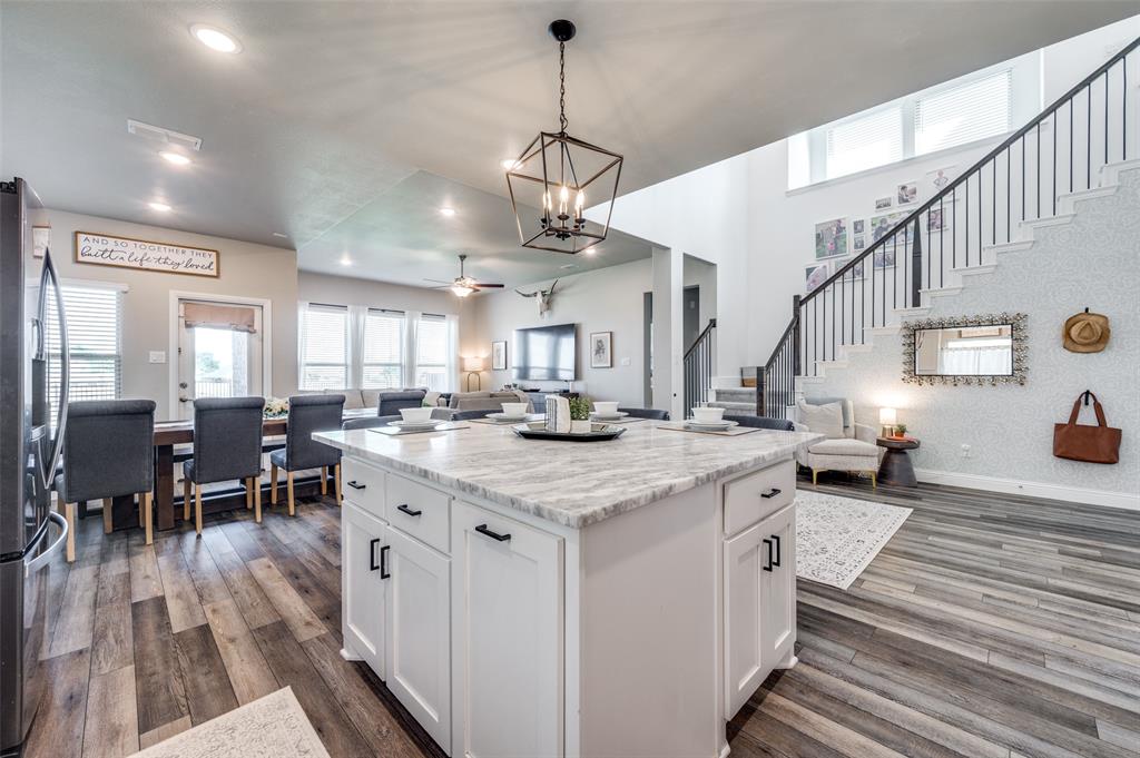 2113 Graham Road Anna, TX 75409 - Photo 13 of 38 a kitchen with stainless steel appliances granite countertop lots of counter top space