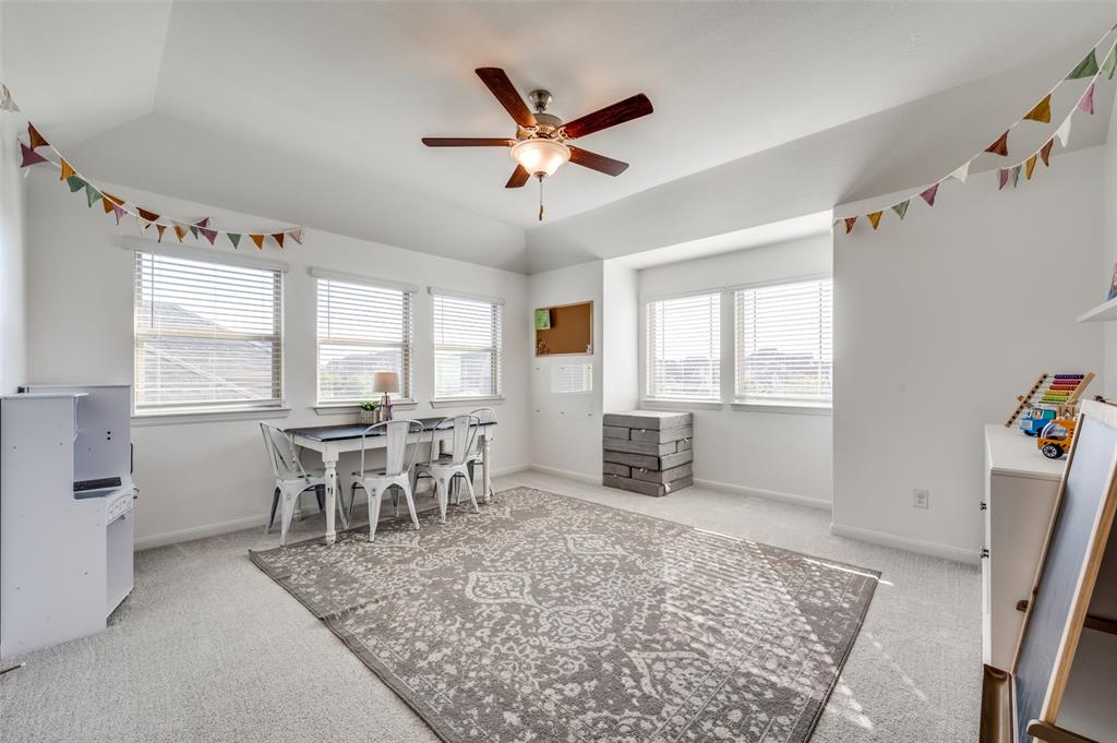2113 Graham Road Anna, TX 75409 - Photo 21 of 38 a dining room with wooden floor and a window