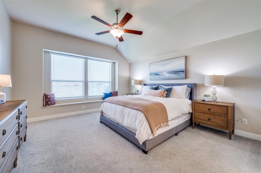 2113 Graham Road Anna, TX 75409 - Photo 22 of 38 a spacious bedroom with a bed and a large window