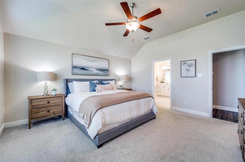 2113 Graham Road Anna, TX 75409 - Photo 23 of 38 a bedroom with a bed and a ceiling fan