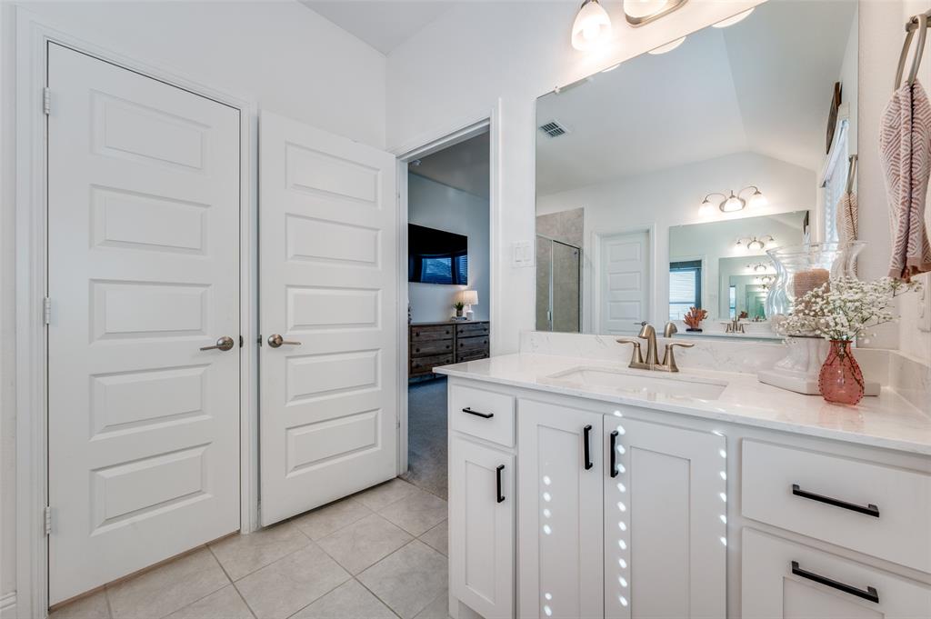 2113 Graham Road Anna, TX 75409 - Photo 26 of 38 a bathroom with a sink and a mirror