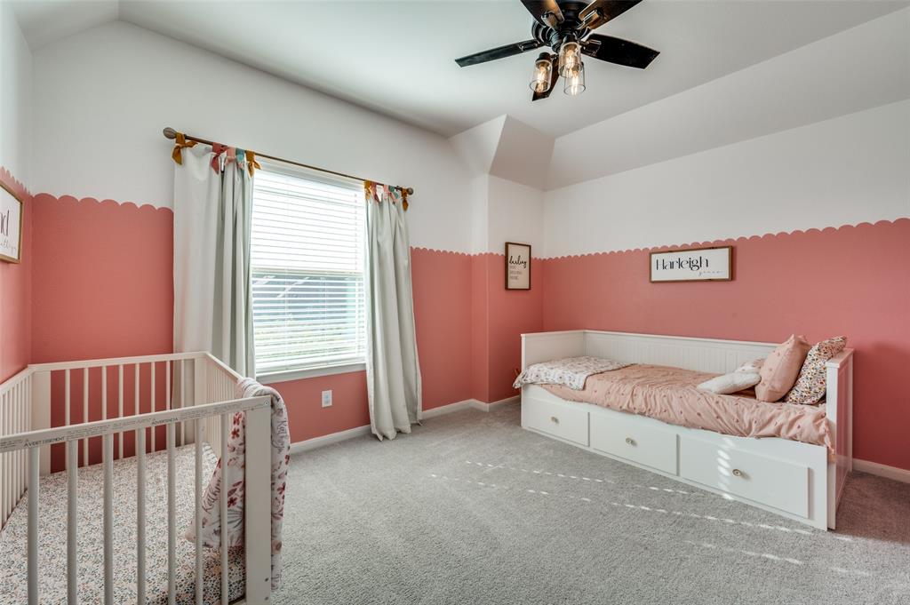 2113 Graham Road Anna, TX 75409 - Photo 29 of 38 a spacious bedroom with a bed and window