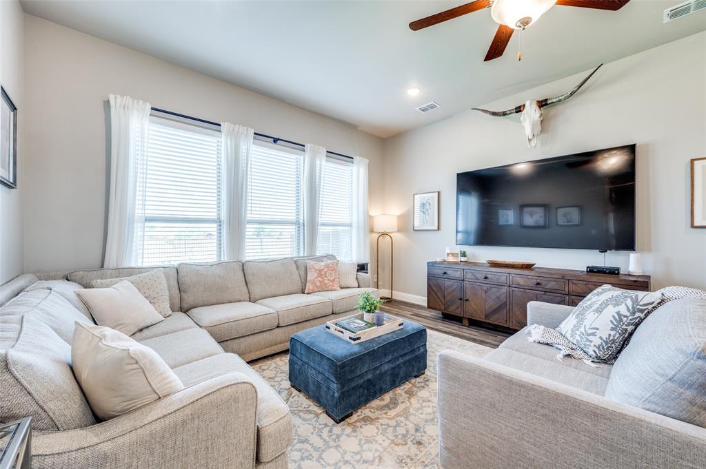 2113 Graham Road Anna, TX 75409 - Photo 7 of 38 a living room with furniture and a flat screen tv
