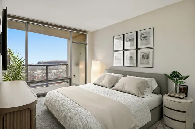 a bedroom with a large bed and a window