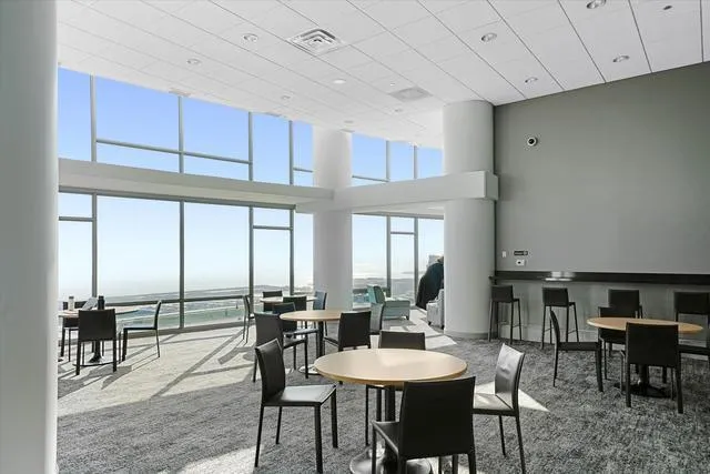 a view of a dining room with furniture window and outside view