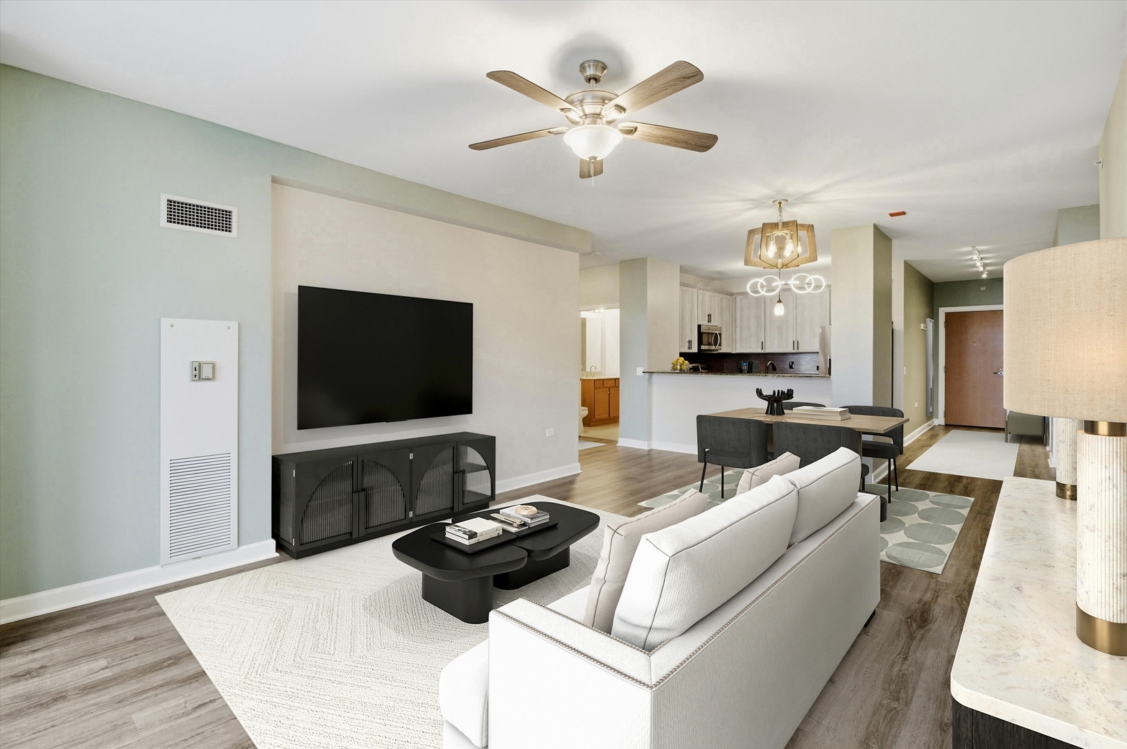 100 East 14th Street, Unit 1204 Chicago, IL 60605 - Photo 6 of 28 a living room with furniture and a flat screen tv