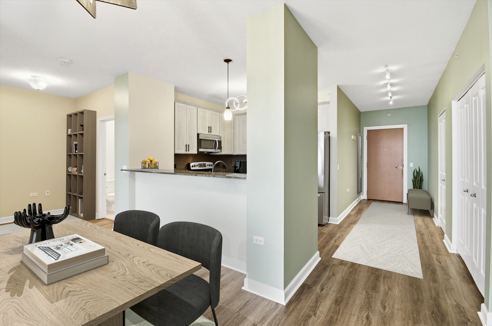 100 East 14th Street, Unit 1204 Chicago, IL 60605 - Photo 9 of 28 a view of a dining room with furniture and wooden floor