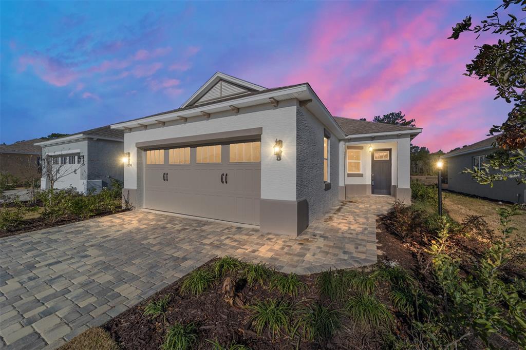 9690 Southwest 108th Terrace Road Ocala, FL 34481 - Photo 1 of 1 a front view of a house with garden