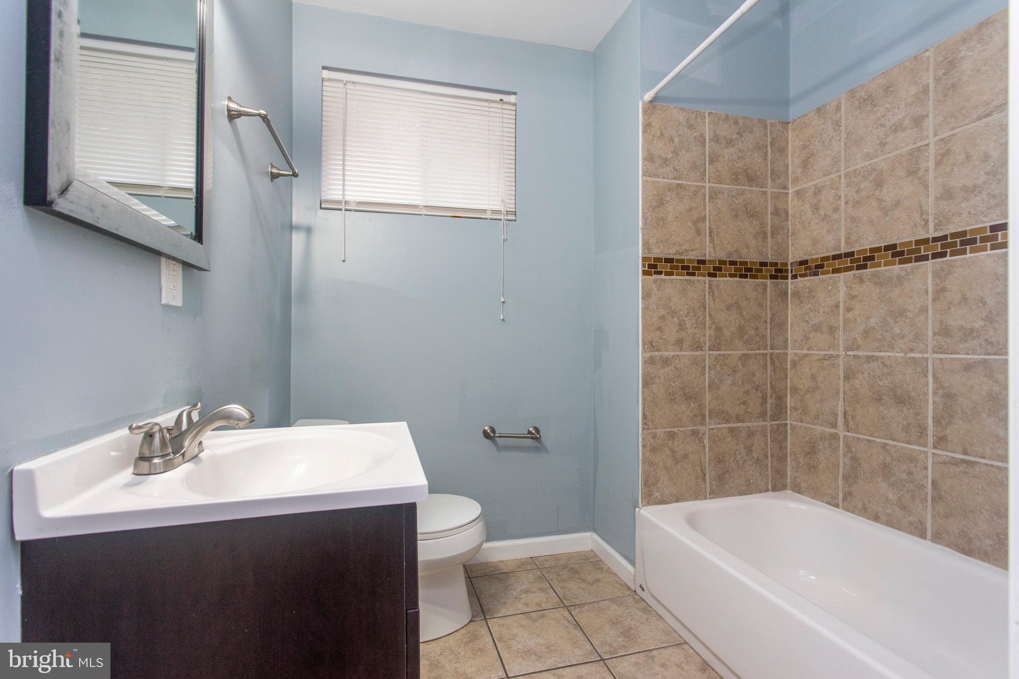 2016 North 18th Street, Unit 2 Philadelphia, PA 19121 - Photo 20 of 23 a bathroom with a sink mirror toilet and bathtub