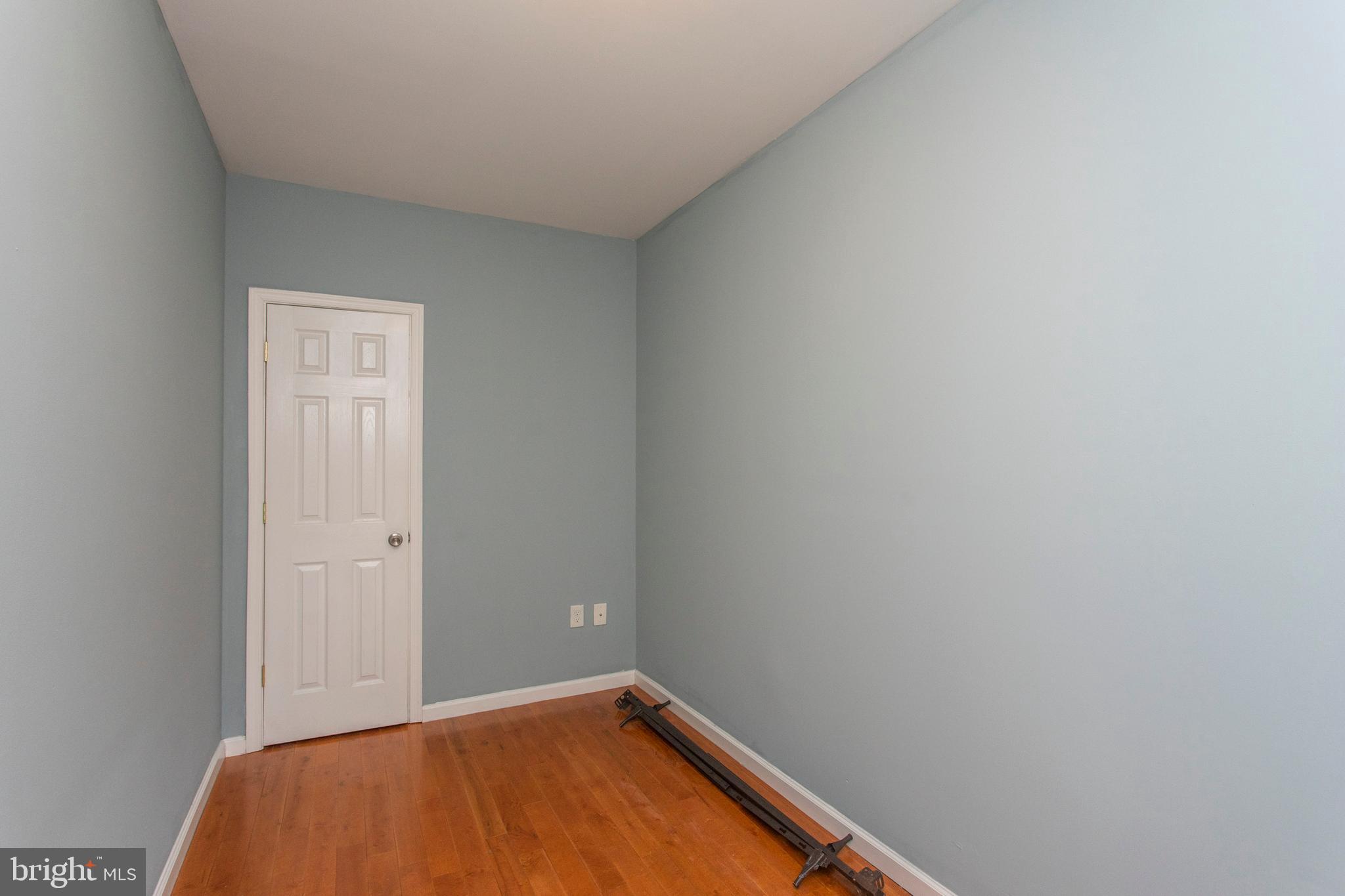 2016 North 18th Street, Unit 2 Philadelphia, PA 19121 - Photo 6 of 23 a view of a room with a wooden floor and a window