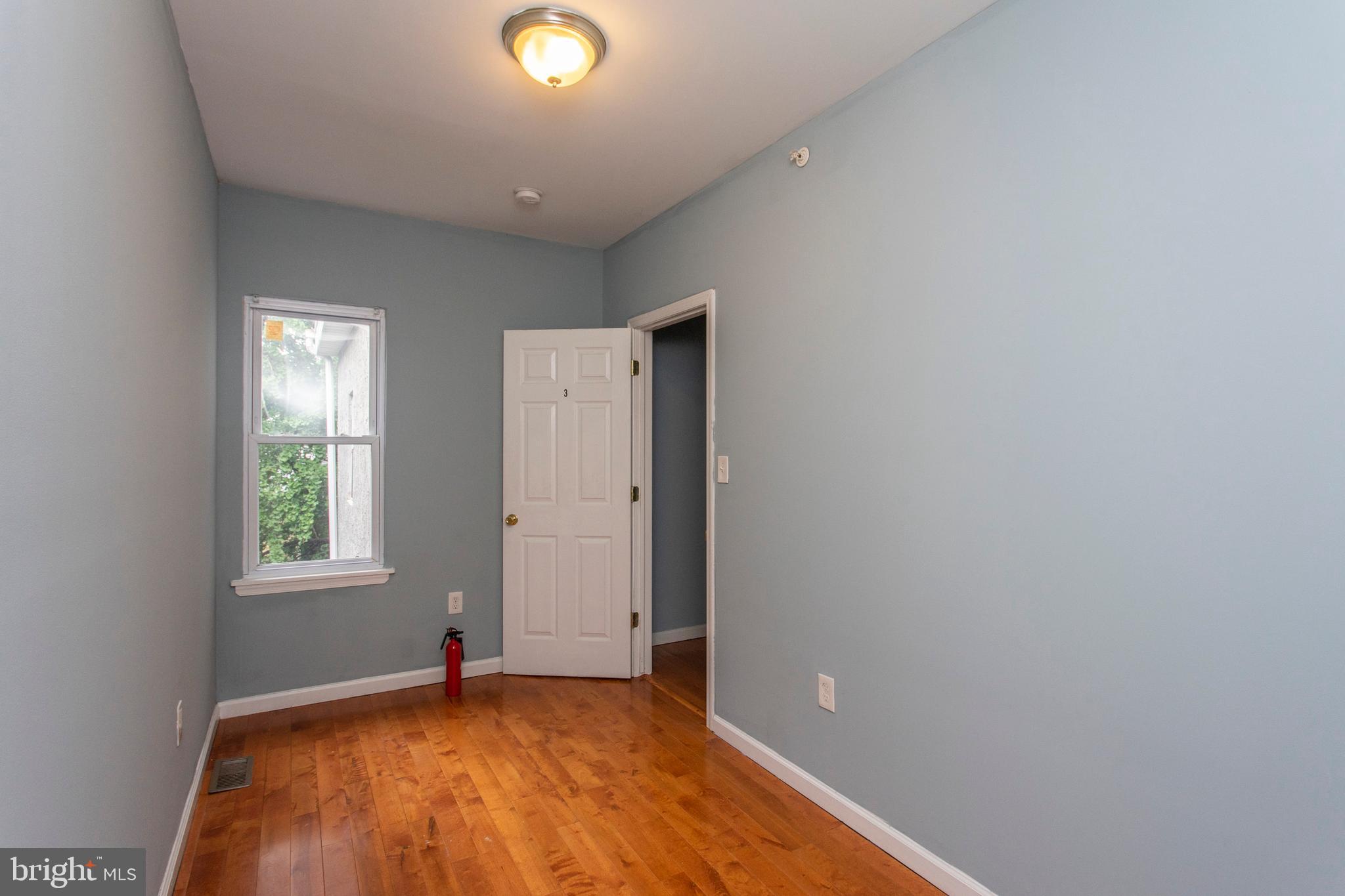 2016 North 18th Street, Unit 2 Philadelphia, PA 19121 - Photo 7 of 23 a view of an empty room with window and closet area