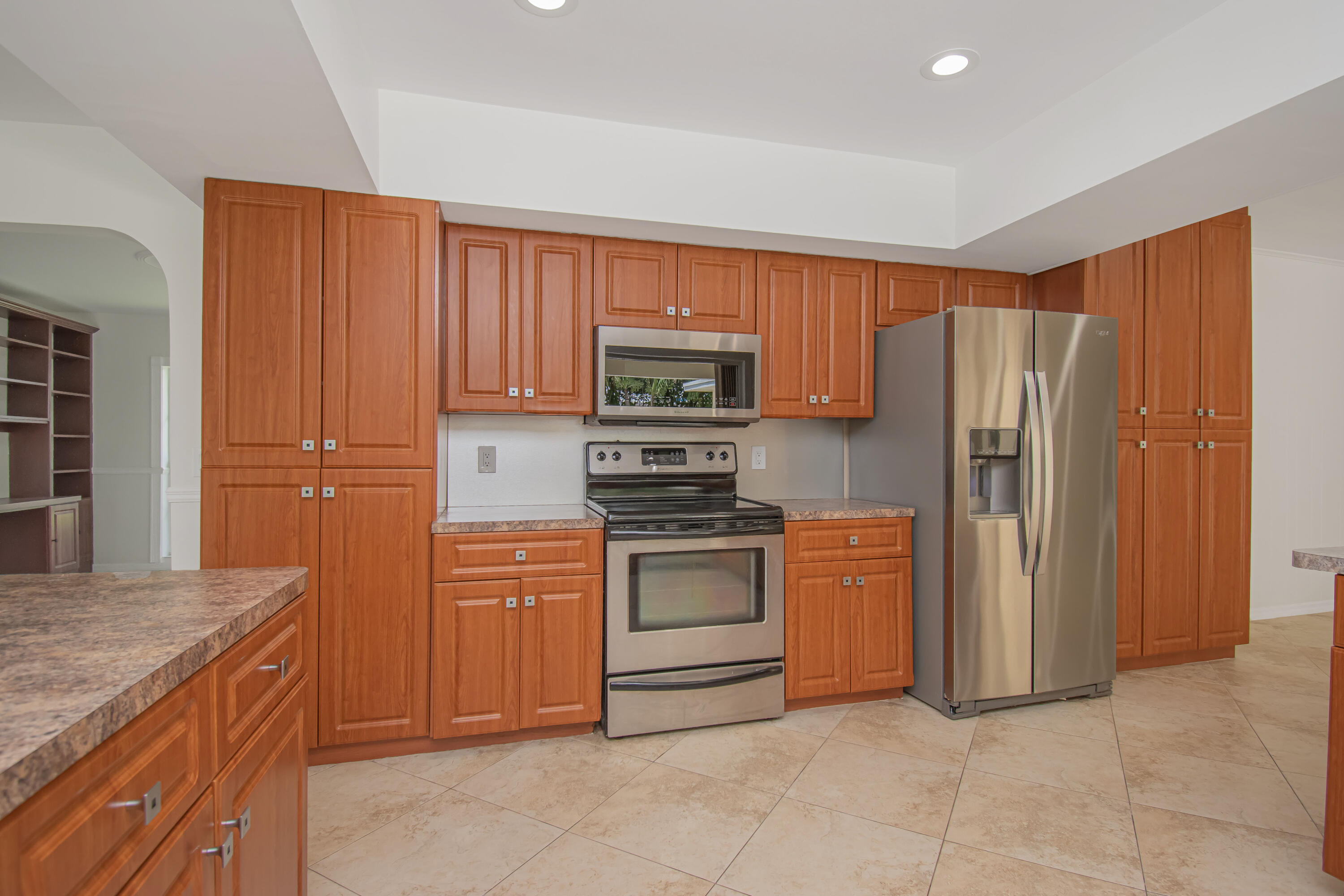 6749 South Grande Drive Boca Raton, FL 33433 - Photo 13 of 35 a kitchen with stainless steel appliances granite countertop a refrigerator stove and sink