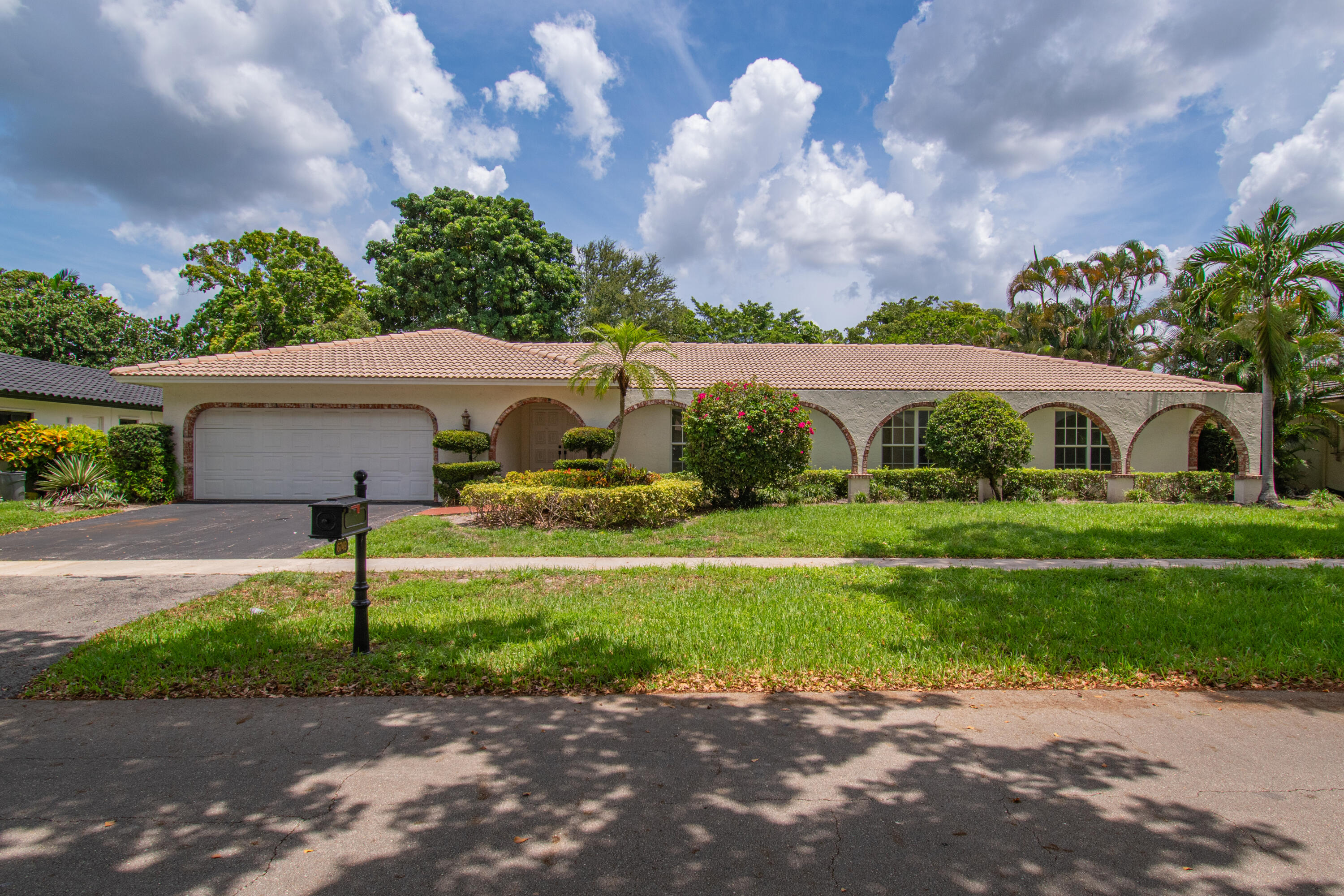 6749 South Grande Drive Boca Raton, FL 33433 - Photo 2 of 35 a front view of house with yard and green space