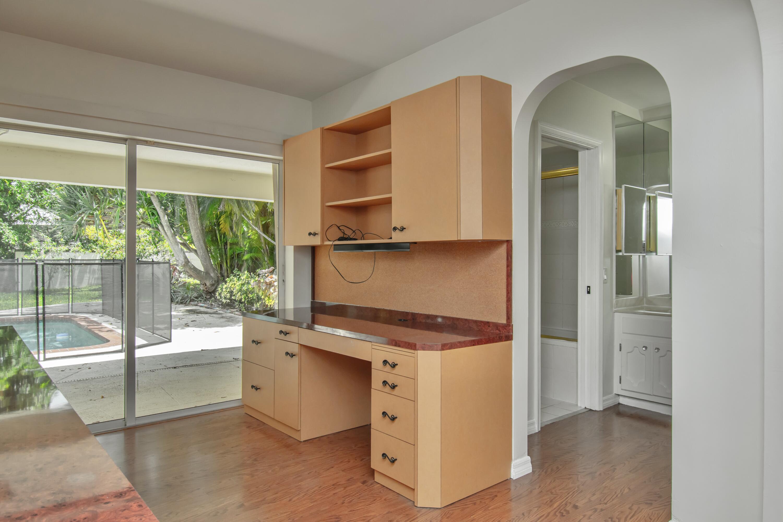 6749 South Grande Drive Boca Raton, FL 33433 - Photo 25 of 35 a view of cabinets and wooden floor