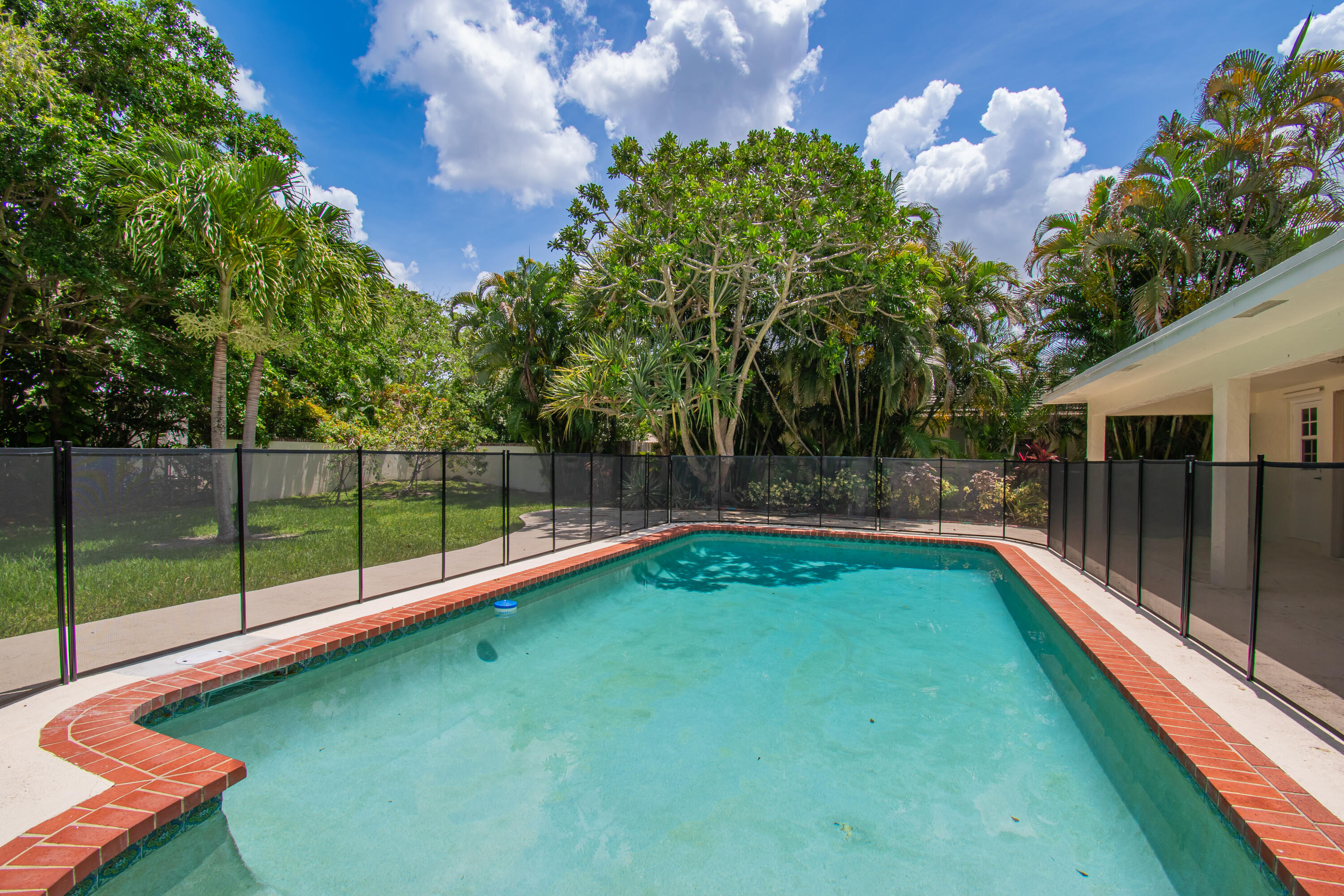 6749 South Grande Drive Boca Raton, FL 33433 - Photo 30 of 35 a view of a backyard with swimming pool