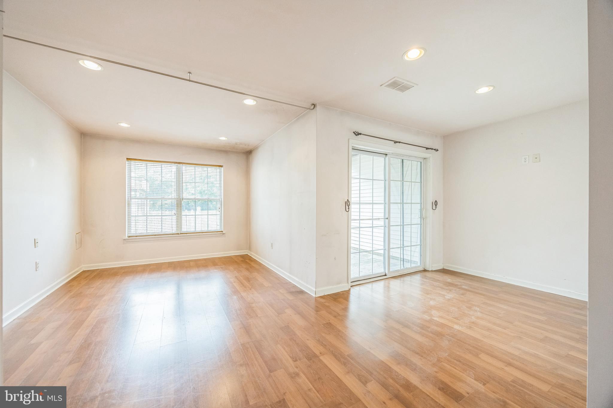 504 Nottingham Place Riverside, NJ 08075 - Photo 30 of 30 an empty room with wooden floor and windows