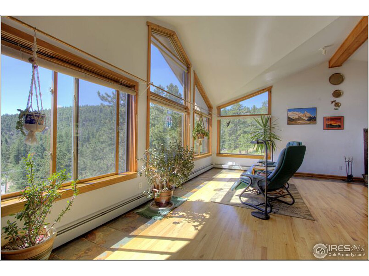 853 Deer Trail Road Boulder, CO 80302 - Photo 20 of 22 a living room with furniture and a floor to ceiling window