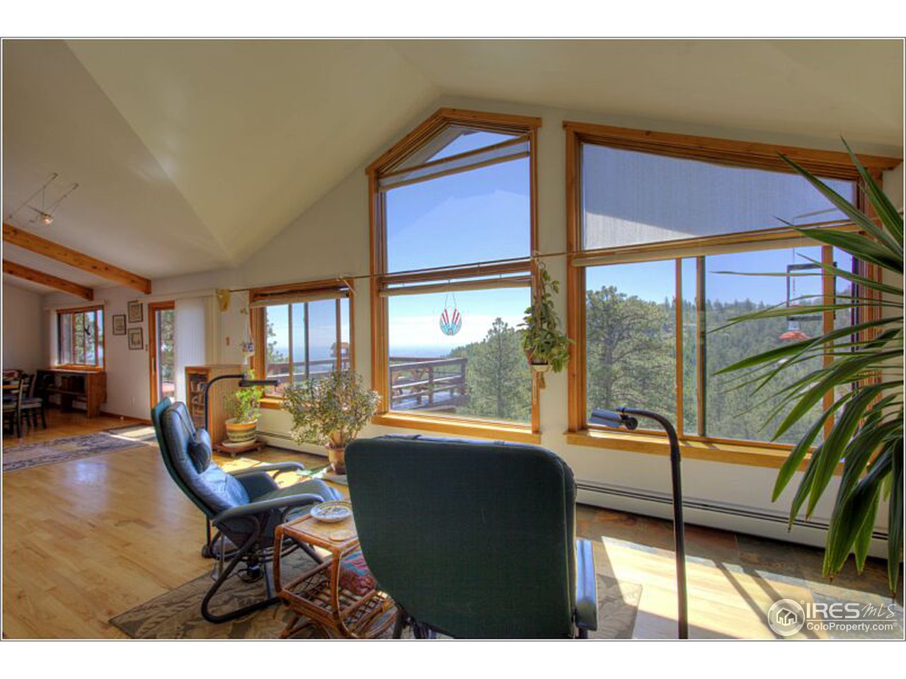 853 Deer Trail Road Boulder, CO 80302 - Photo 2 of 22 a living room with furniture and a floor to ceiling window