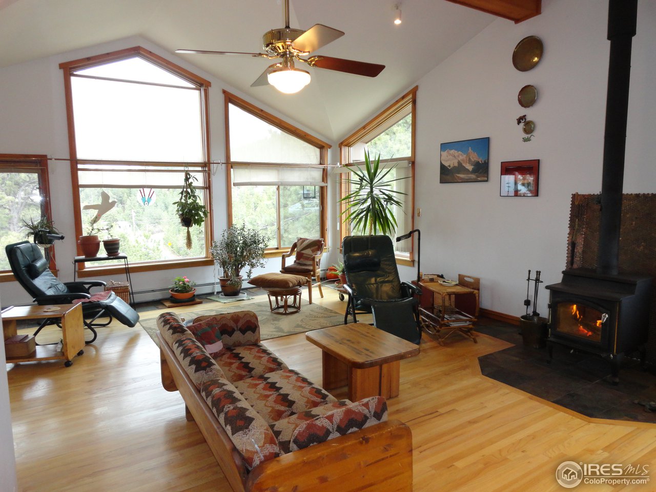 853 Deer Trail Road Boulder, CO 80302 - Photo 21 of 22 a living room with furniture fireplace and a large window