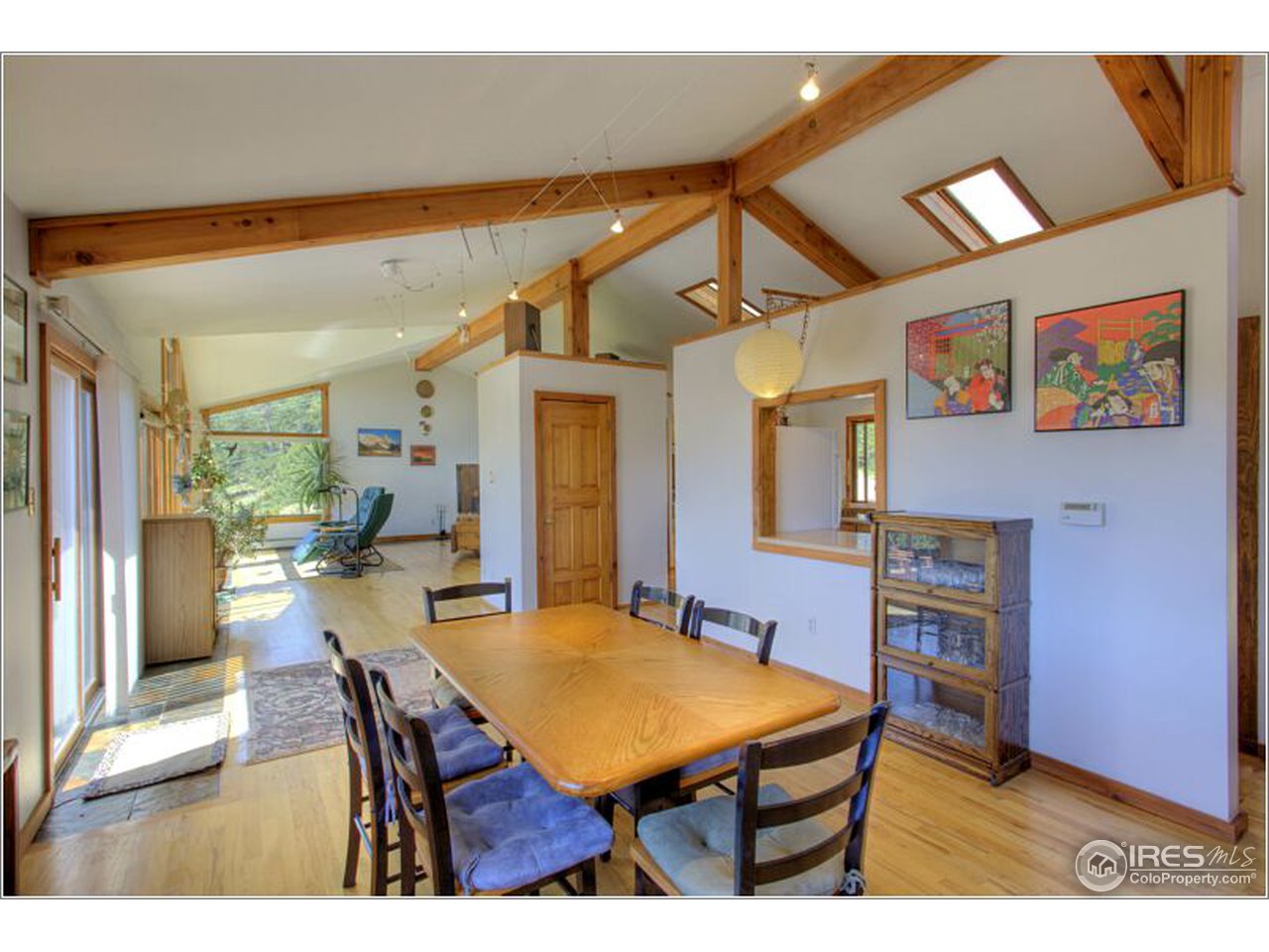 853 Deer Trail Road Boulder, CO 80302 - Photo 22 of 22 a dining room with a wooden table and chairs