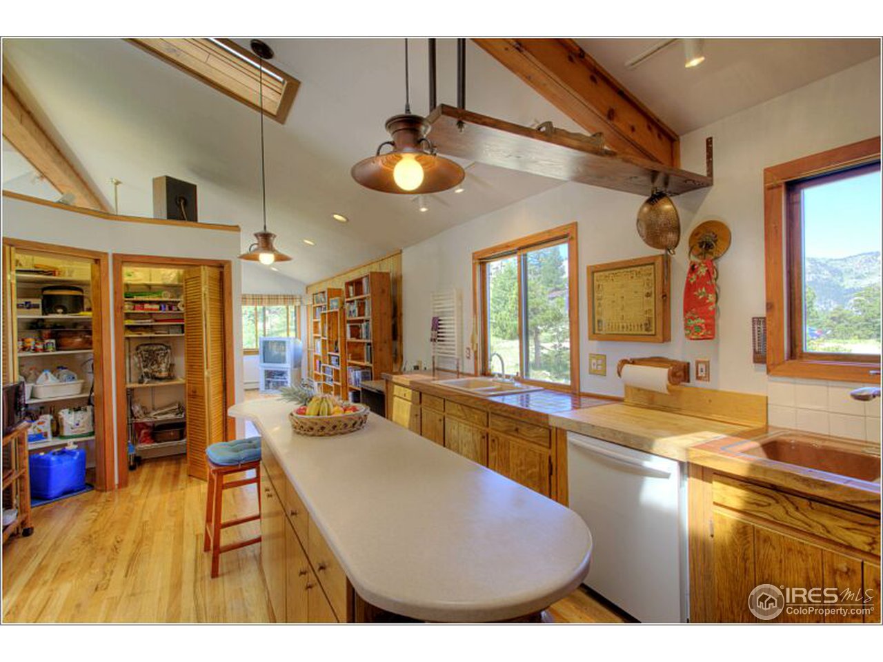853 Deer Trail Road Boulder, CO 80302 - Photo 3 of 22 a kitchen with stainless steel appliances granite countertop a sink and cabinets