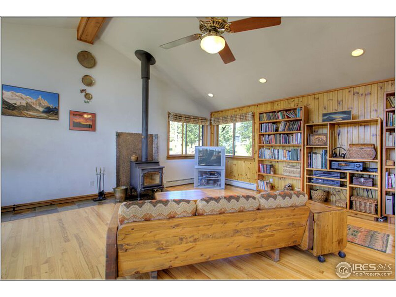 853 Deer Trail Road Boulder, CO 80302 - Photo 10 of 22 a living room with furniture and a flat screen tv