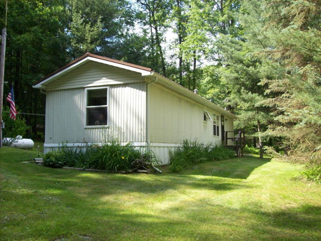 67 Skip Lane Strattanville, PA 16258 - Photo 1 of 1 a view of a yard in front of house