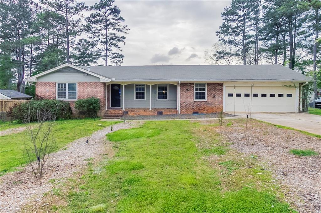 3092 Ranlo Drive Atlanta, GA 30340 - Photo 1 of 1 a front view of a house with garden