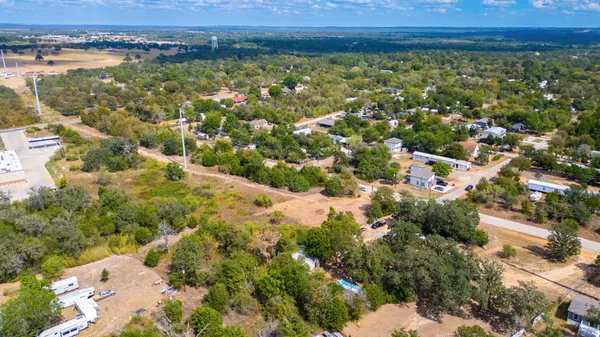 an aerial view of residential building with outdoor space and lake view