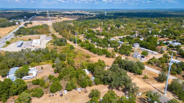 an aerial view of residential building with outdoor space and lake view