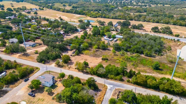 an aerial view of house with yard