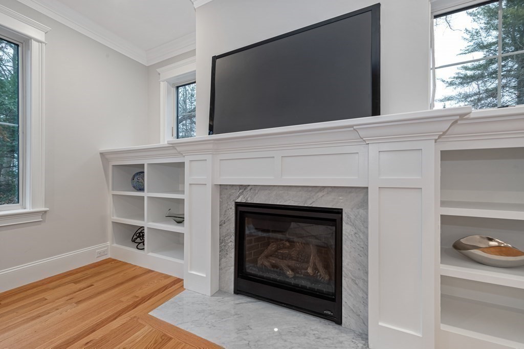 3 Crawford Road Lexington, MA 02420 - Photo 18 of 42 a living room with a fireplace