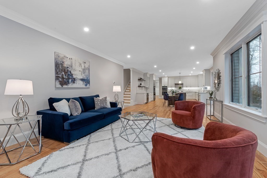 3 Crawford Road Lexington, MA 02420 - Photo 19 of 42 a living room with furniture a couch and a coffee maker next to a window