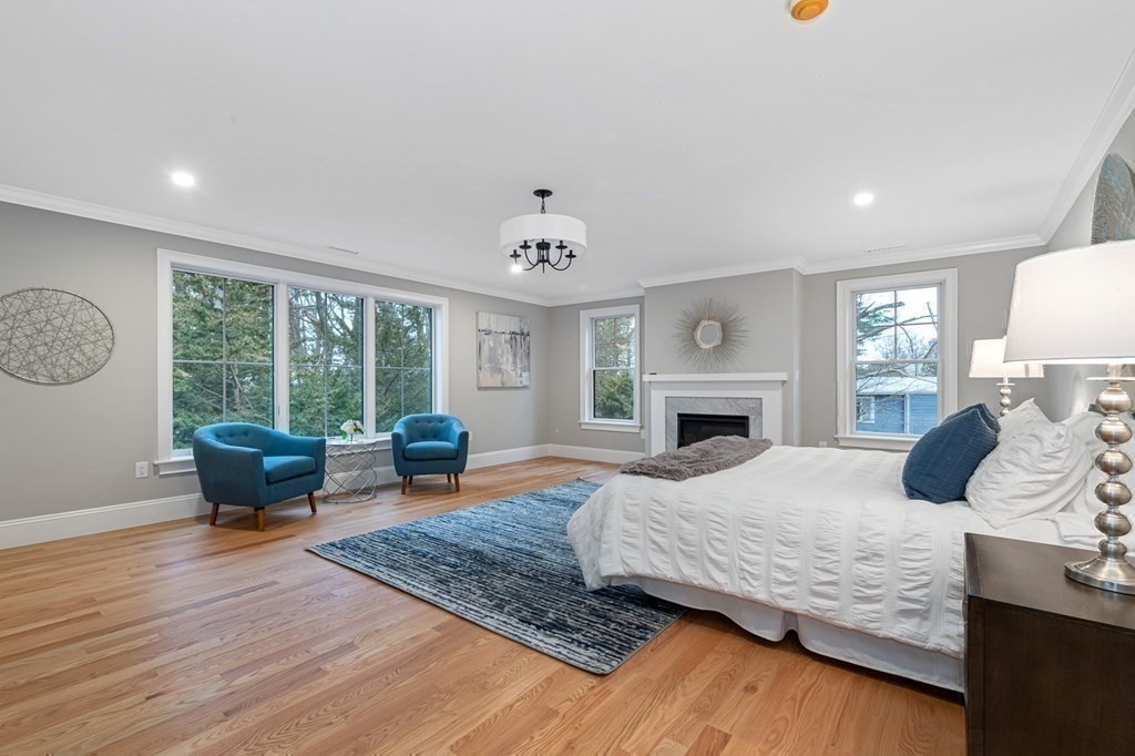 3 Crawford Road Lexington, MA 02420 - Photo 21 of 42 a bedroom with a bed a large window and couch