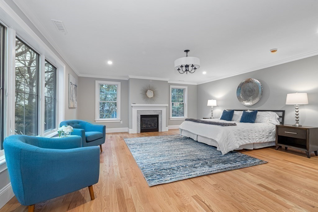 3 Crawford Road Lexington, MA 02420 - Photo 22 of 42 a living room with furniture and a fireplace