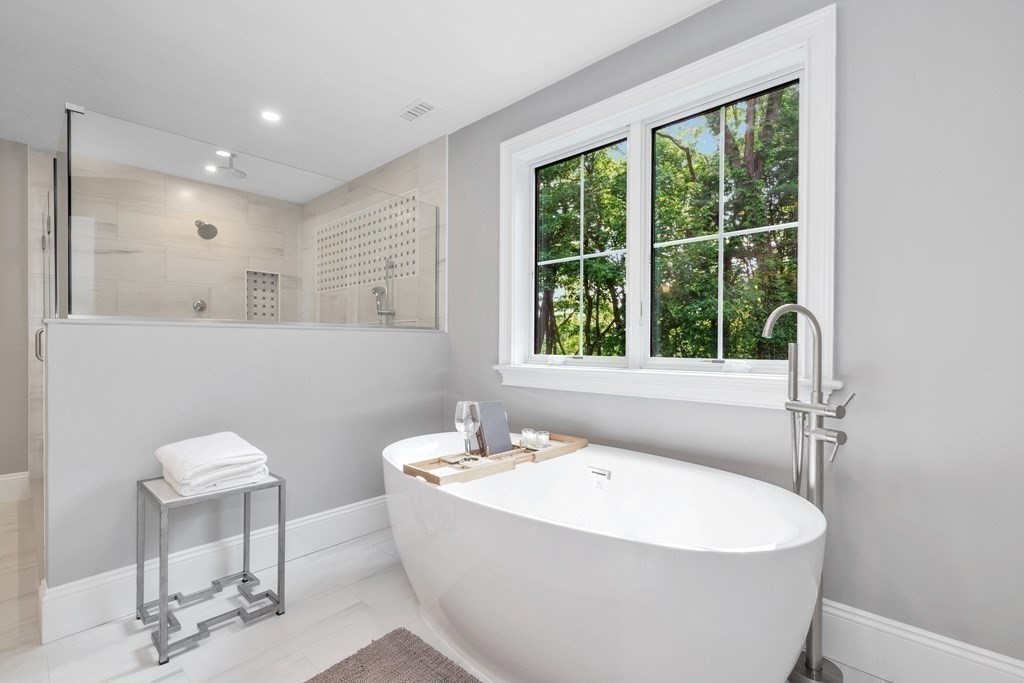 3 Crawford Road Lexington, MA 02420 - Photo 25 of 42 a white bath tub sitting next to a white sink