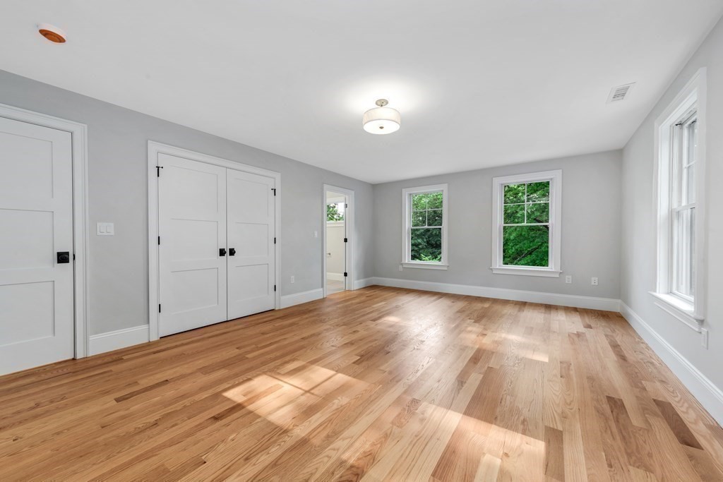 3 Crawford Road Lexington, MA 02420 - Photo 28 of 42 a view of an empty room with wooden floor and a window