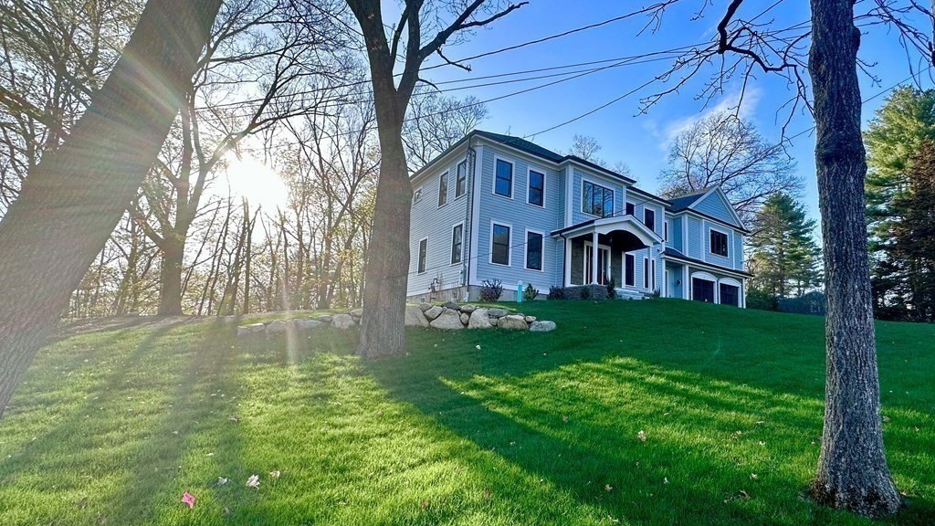 3 Crawford Road Lexington, MA 02420 - Photo 3 of 42 a front view of a house with garden