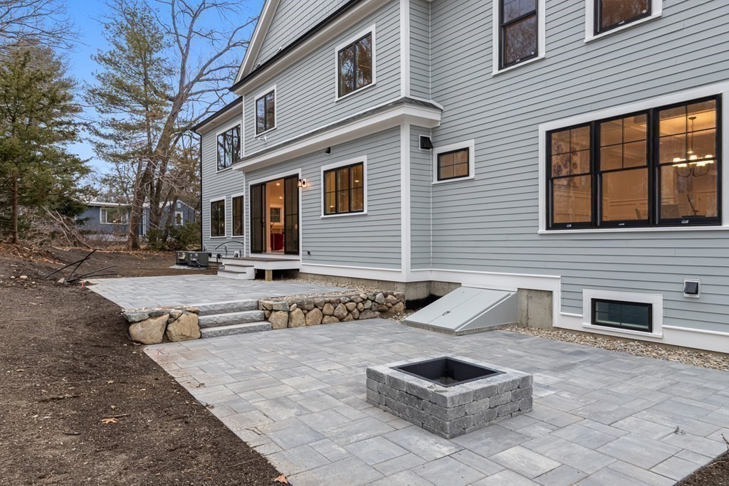 3 Crawford Road Lexington, MA 02420 - Photo 33 of 42 a front view of a house with a yard