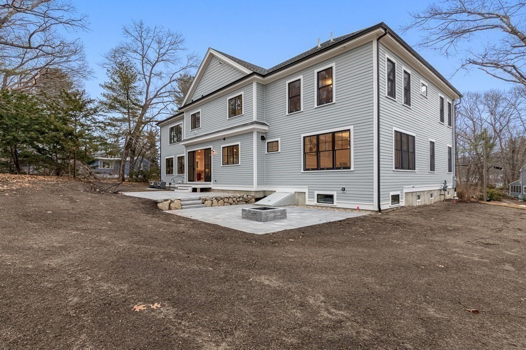 3 Crawford Road Lexington, MA 02420 - Photo 34 of 42 a front view of a house with yard and trees