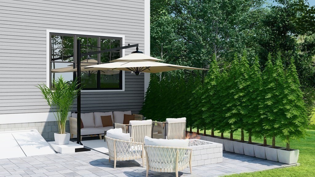 3 Crawford Road Lexington, MA 02420 - Photo 40 of 42 a view of a patio with a table chairs and a potted plant