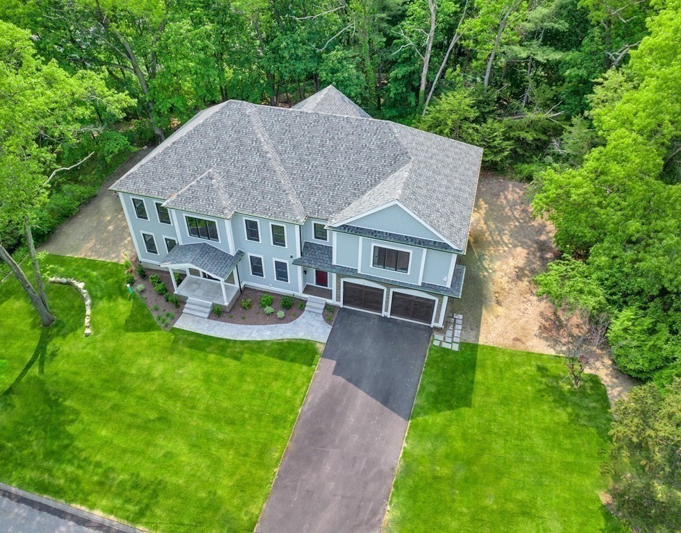 3 Crawford Road Lexington, MA 02420 - Photo 41 of 42 a aerial view of a house with a yard table and chairs