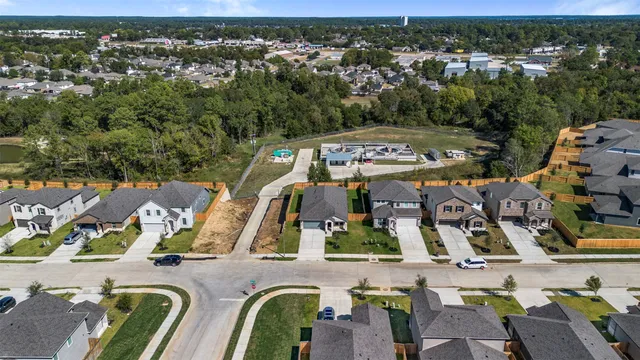 an aerial view of residential houses with outdoor space