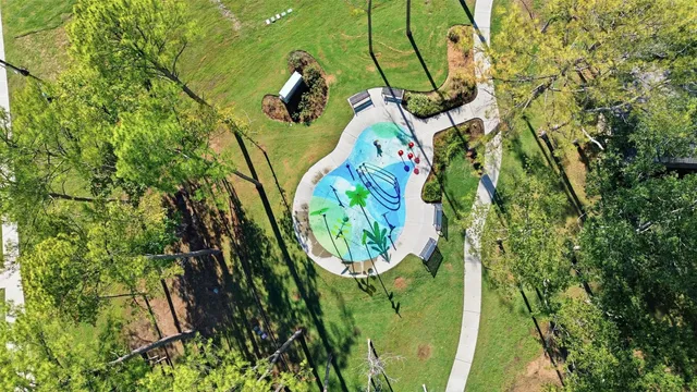 an aerial view of a yard with plants and large trees