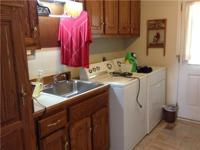 516 Locust Grove Road Watertown, TN 37184 - Photo 15 of 20 view of utility room, half bath.