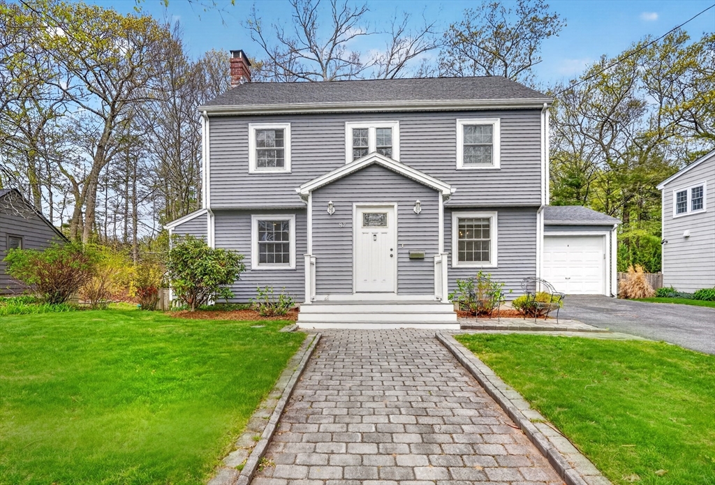 87 Payson Road Brookline, MA 02467 - Photo 1 of 41 a front view of a house with a yard and trees