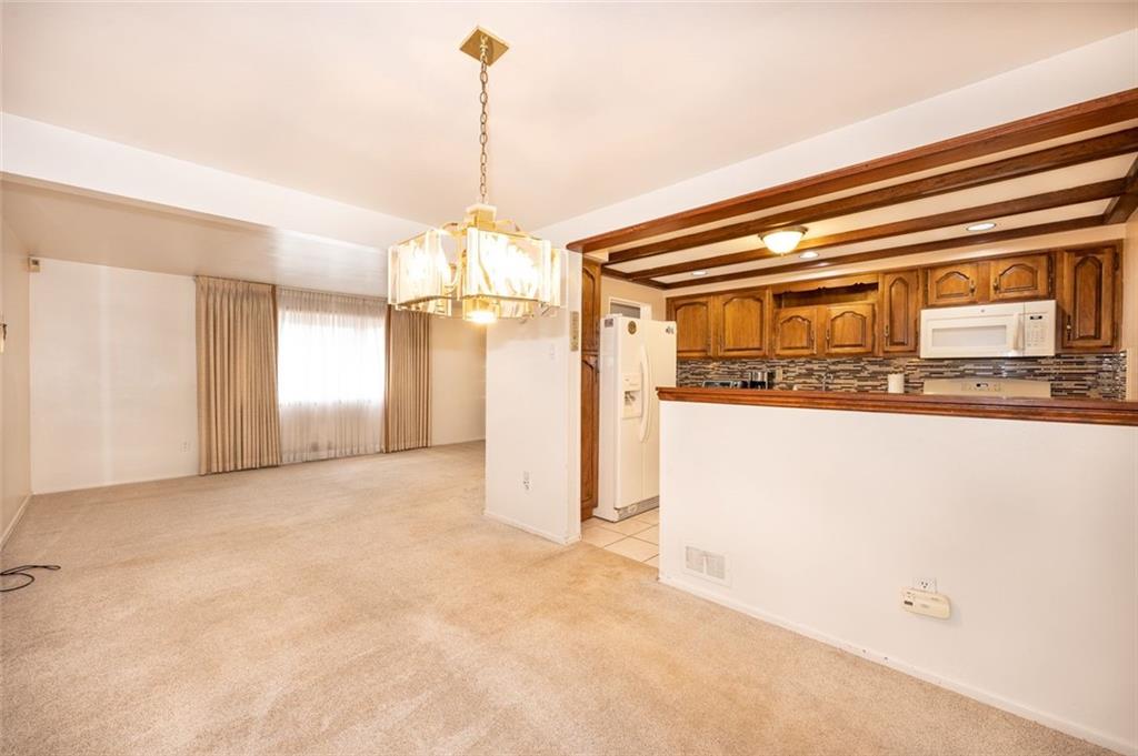 1342 Cathell Road Pittsburgh, PA 15236 - Photo 11 of 31 a view of a hallway with a refrigerator