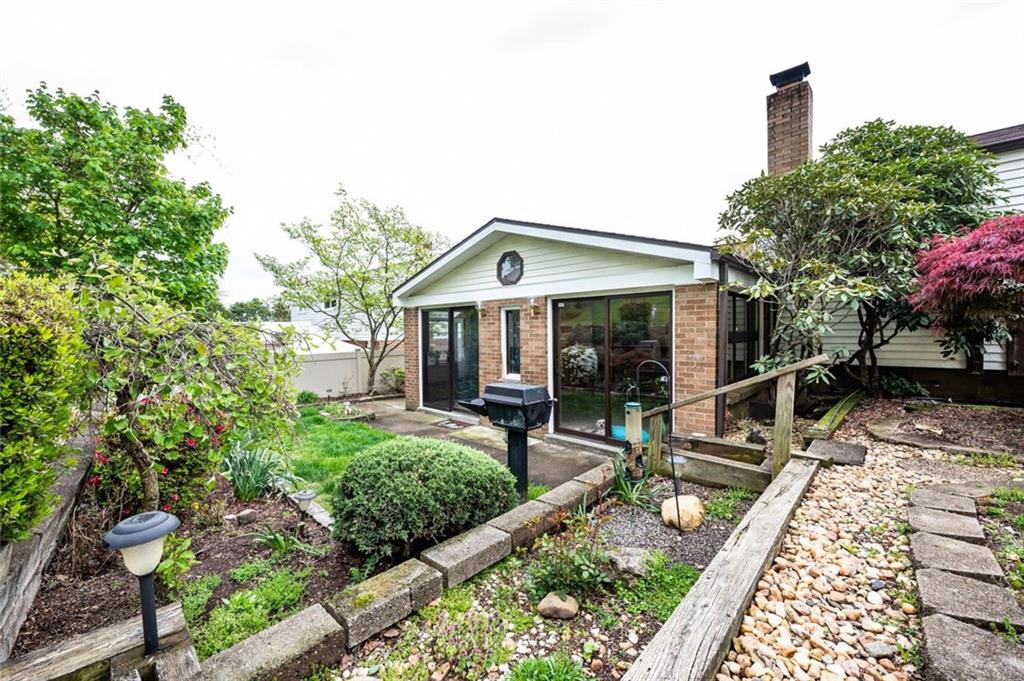 1342 Cathell Road Pittsburgh, PA 15236 - Photo 17 of 31 a front view of house with yard seating and green space